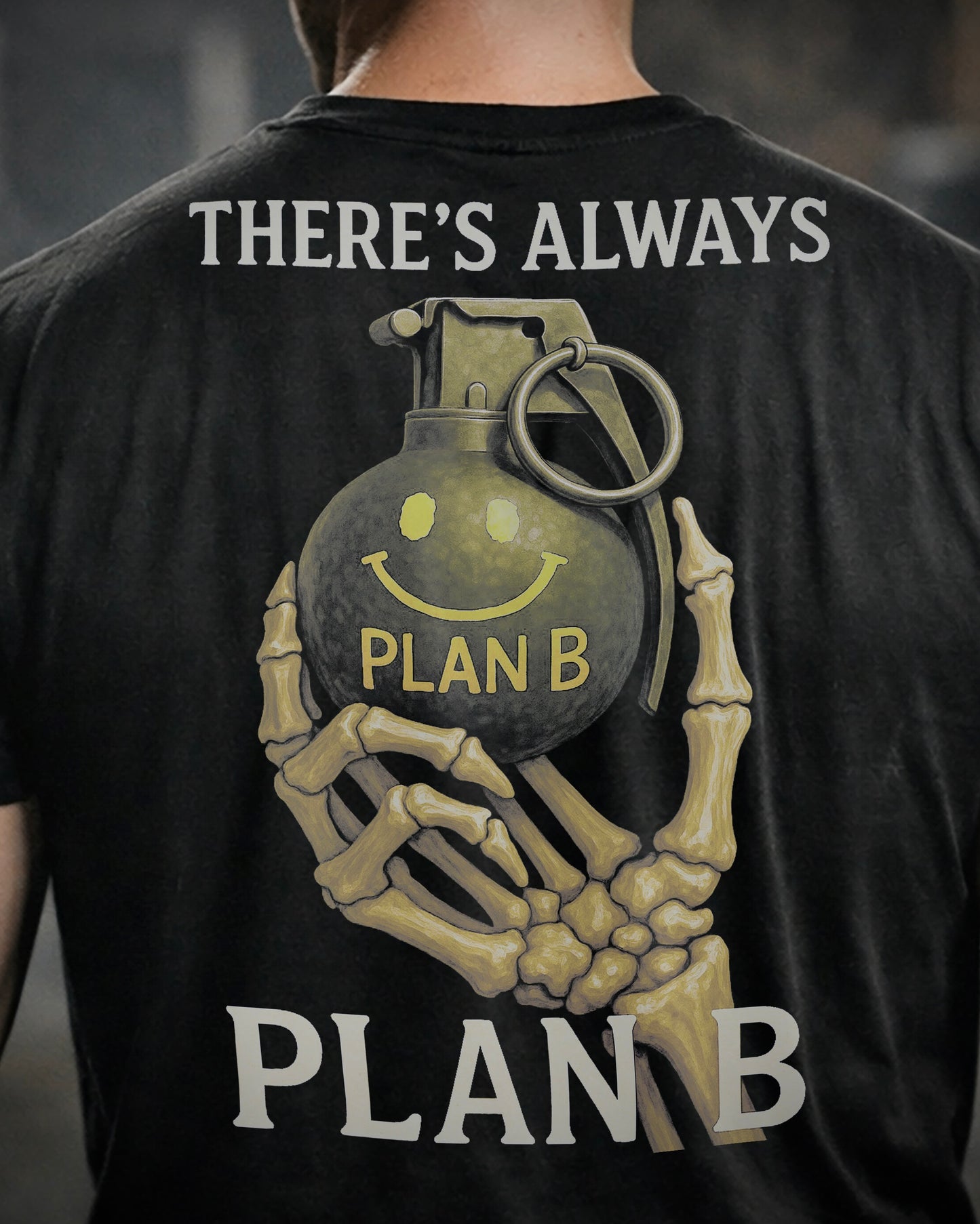 Close up of back view of man wearing black Achilles T-shirt printed with large Plan B logo on back