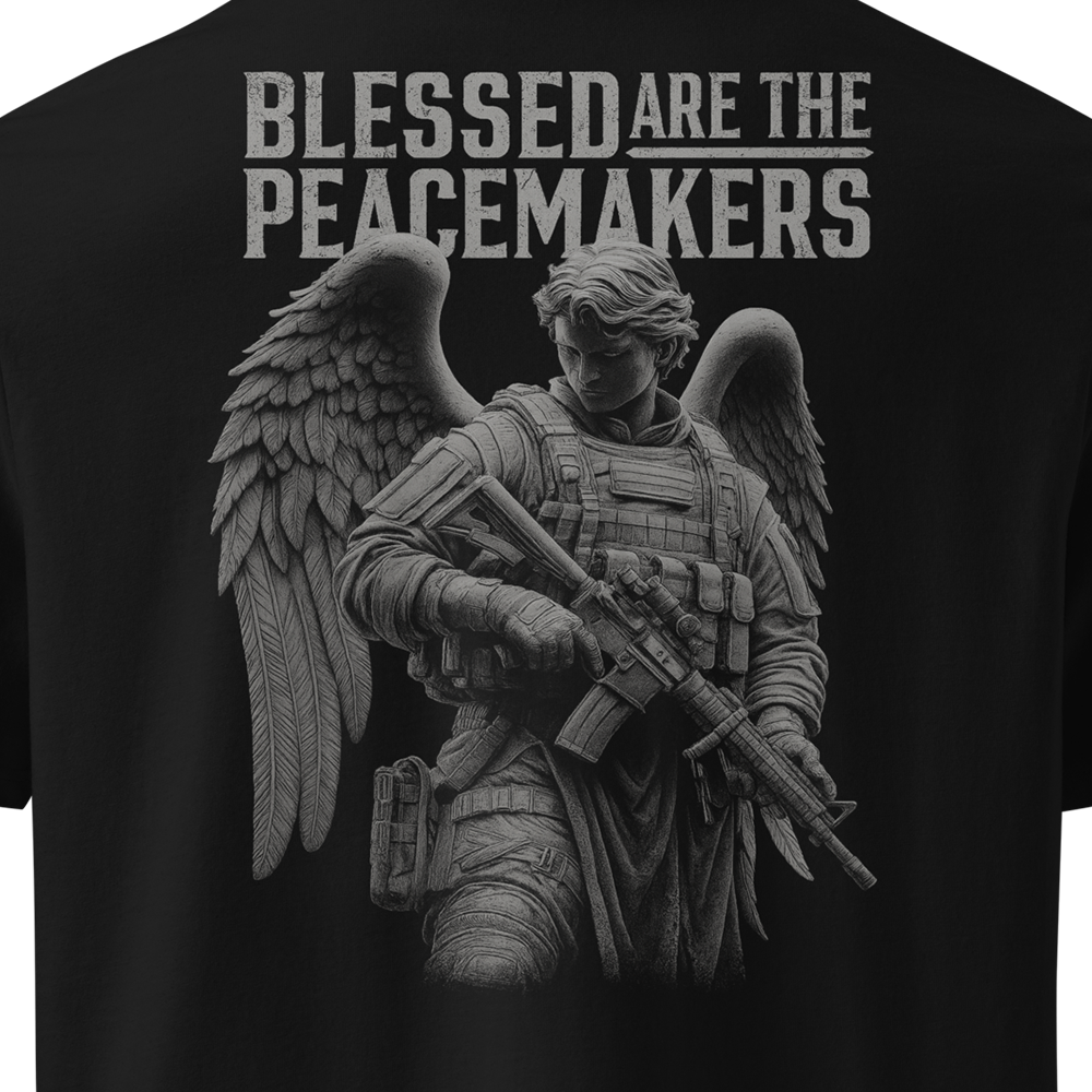 Black t-shirt with an angelic figure holding a rifle and 'Blessed are the Peacemakers' text.