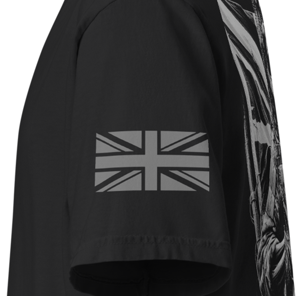 Close up of left sleeve of Black short sleeve unisex fit classic cotton T-Shirt by Achilles Tactical Clothing Brand printed with Large Defending the flag design across back