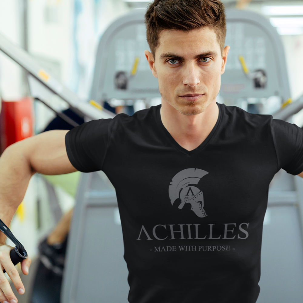 Front of man doing cable flyes in the gym wearing black training shirt by Achilles Tactical Clothing Brand with Signature logo across chest