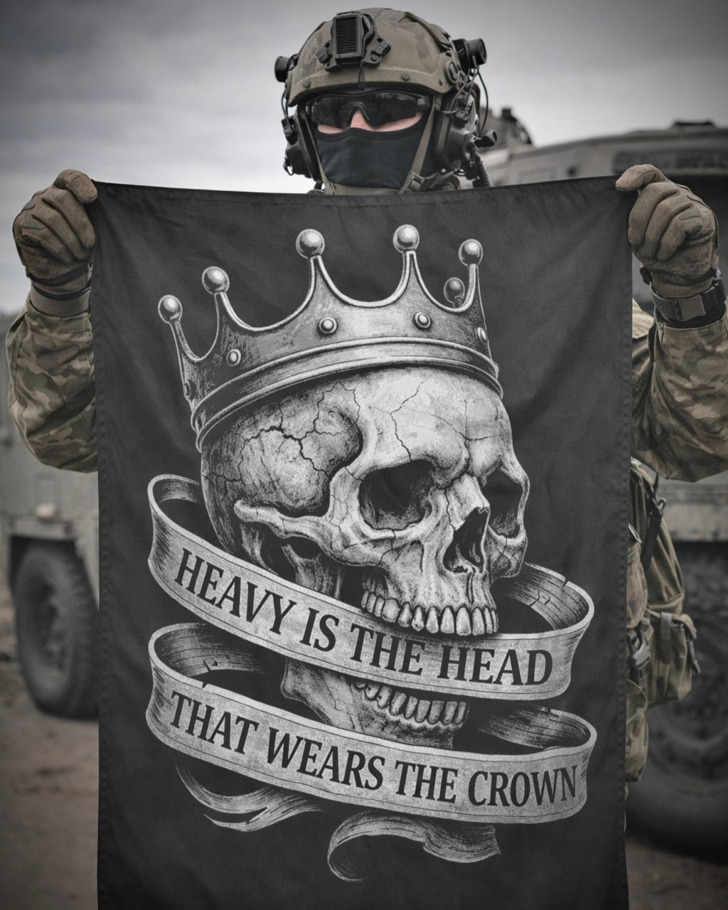 Soldier holding the Achilles HEAVY IS THE HEAD vertical banner flag