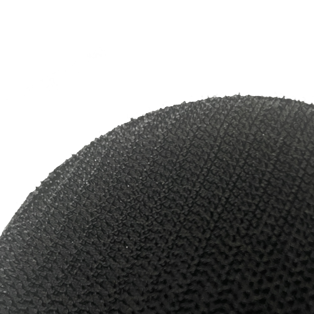 Black PVC 3D Achilles patch with close up of a velcro hook and loop backing on a white background