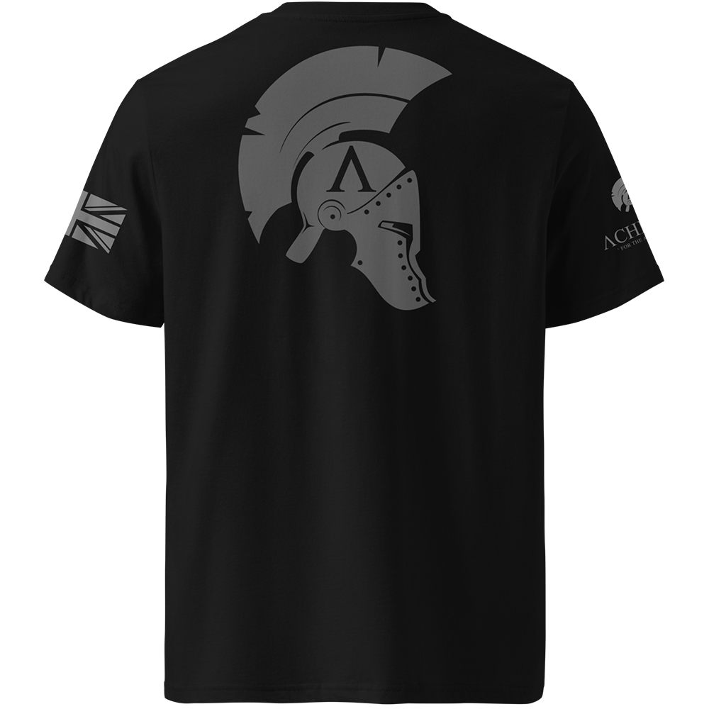 Black t-shirt with a graphic of a helmet and logos on the back, displayed against a white background.