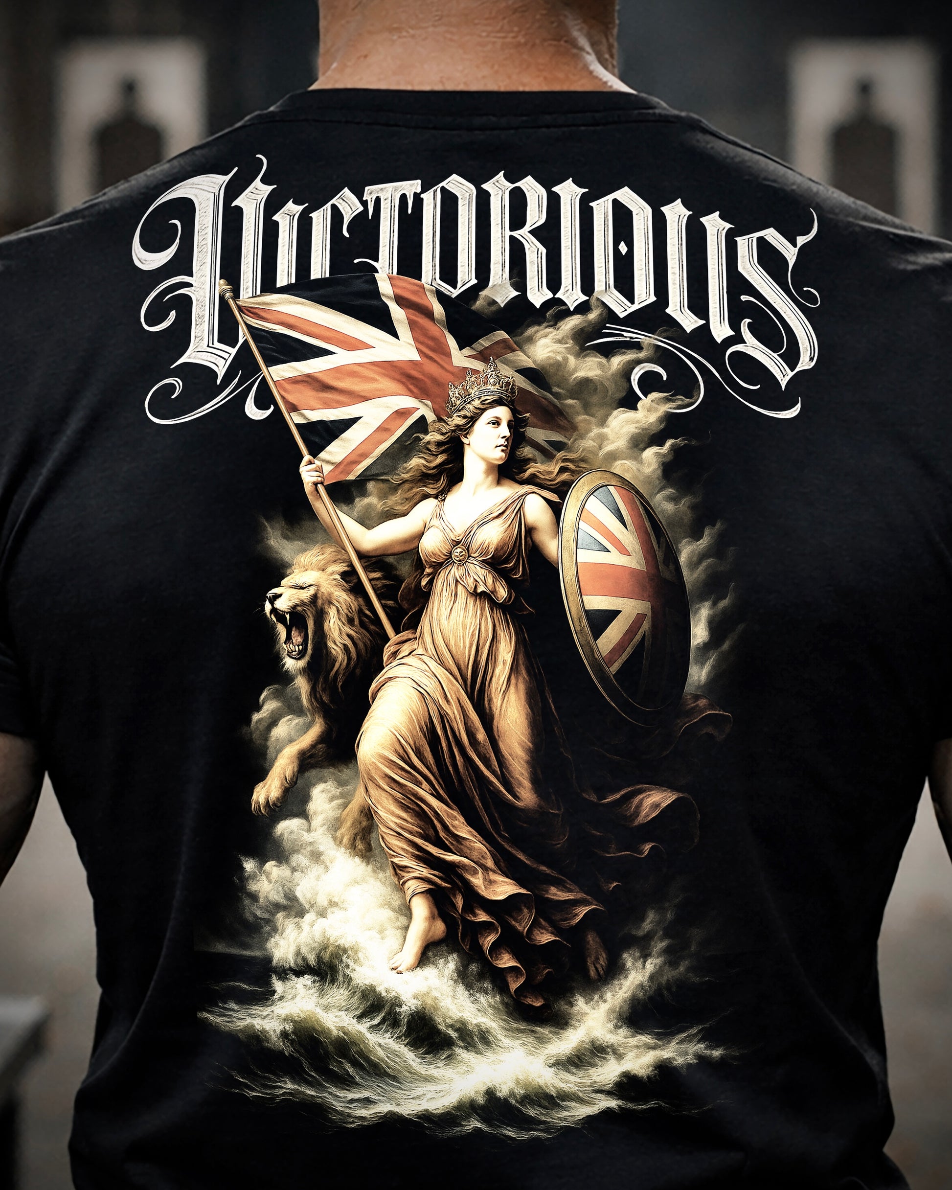 Close up of back view of man wearing black Achilles T-shirt printed with large Victorious design on back