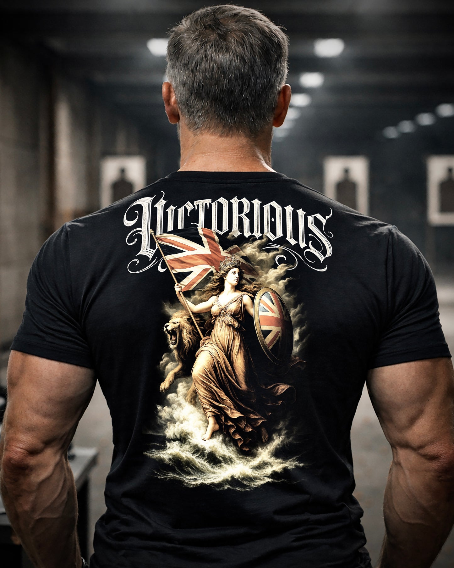 Back view of man wearing black Achilles T-shirt printed with large Victorious design on back