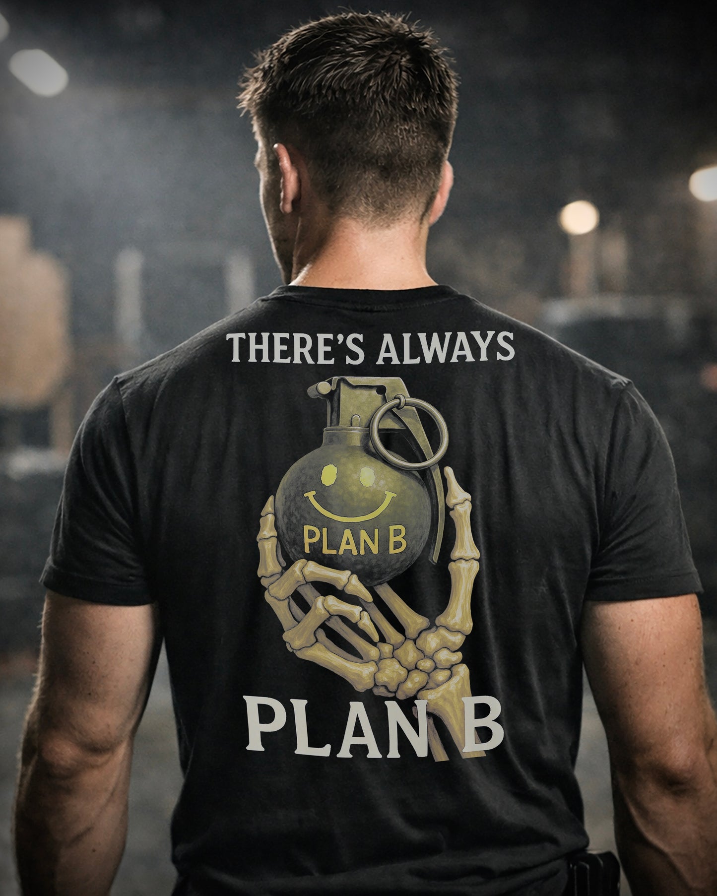 Back view of man wearing black Achilles T-shirt printed with large Plan B logo on back