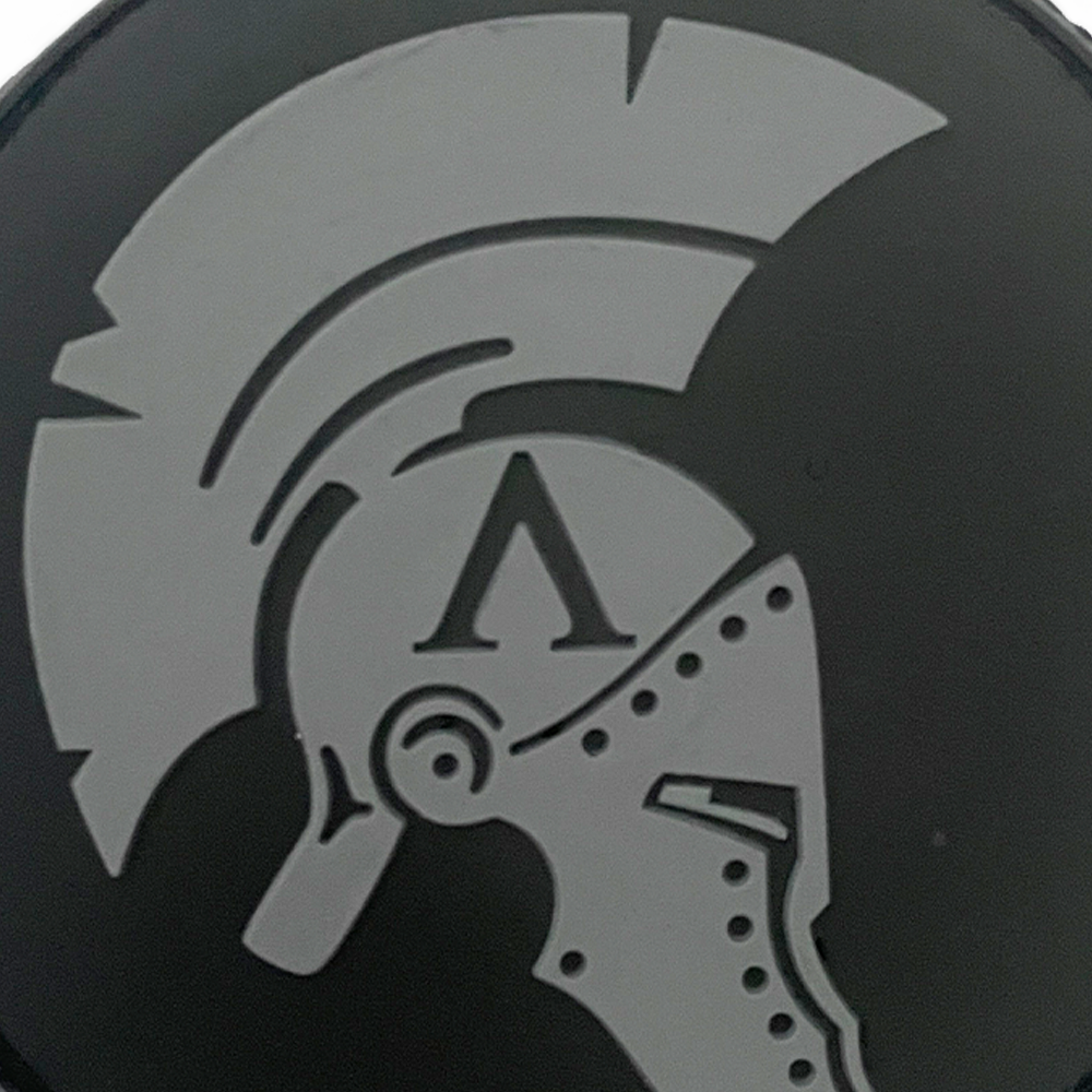 Black PVC 3D Achilles patch with grey Helmet with a crest and letter 'Λ' on a black background