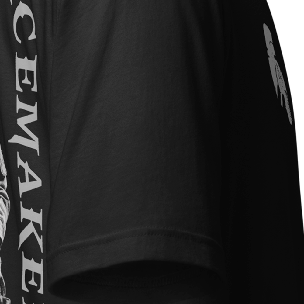 Close up of right sleeve of Black short sleeve unisex fit original cotton T-Shirt by Achilles Tactical Clothing Brand printed with Blessed are the peacemakers design across back