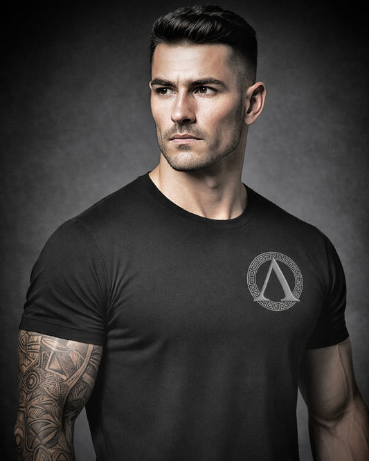 Front view of man wearing Achilles insignia brand logo T-shirt