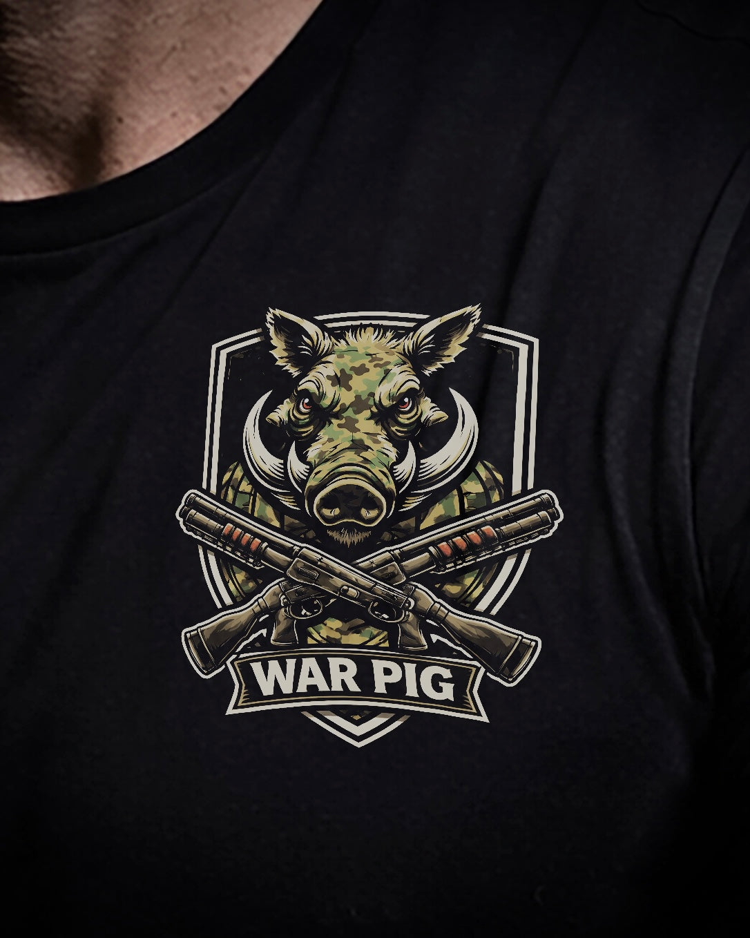 Close up of front view of man wearing black Achilles T-shirt printed with War Pig logo on front chest