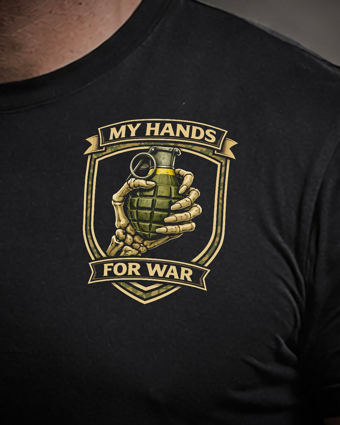 Close up of front view of man wearing black Achilles T-shirt printed with My Hands For War logo on front chest