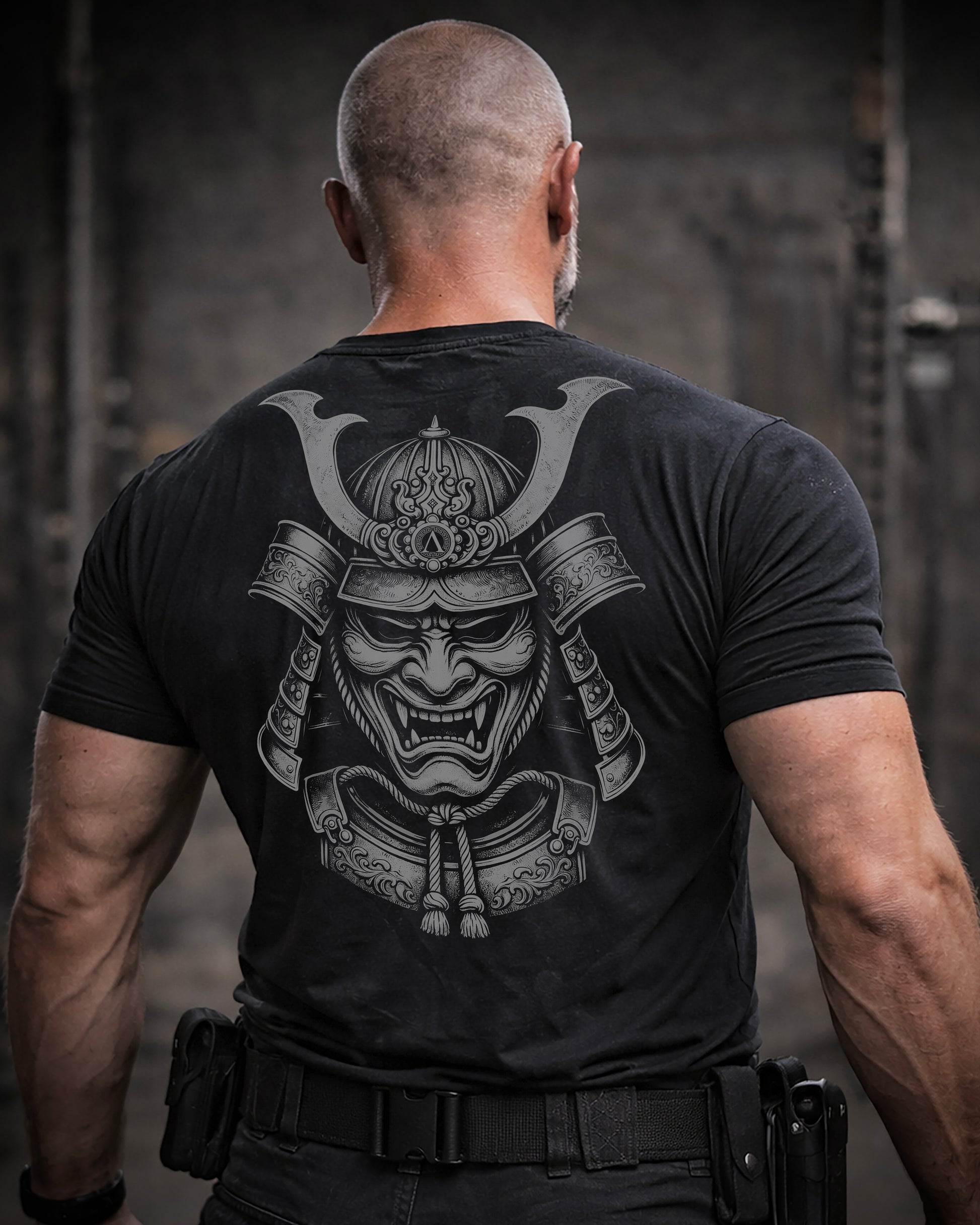 Back view of man wearing black Achilles T-shirt printed with large Ronin logo on back