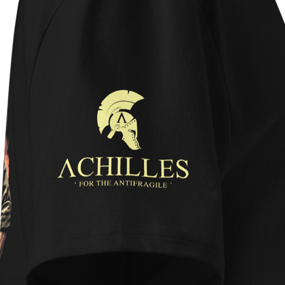 Black T-shirt sleeve with yellow 'Achilles' logo and text on a dark background