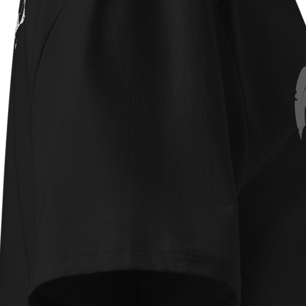Black t-shirt sleeve with a small white logo on the sleeve against a white background