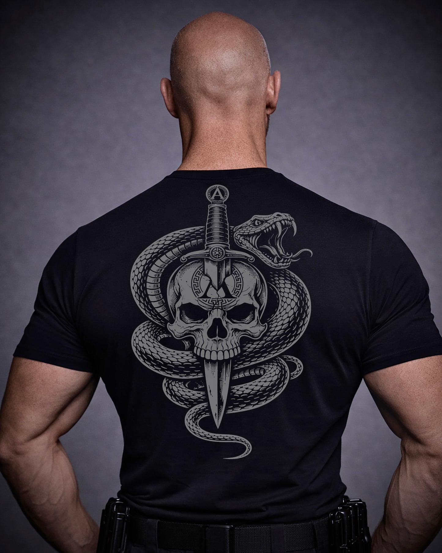 Back view of man wearing black Achilles T-shirt printed with Large Venom logo on back